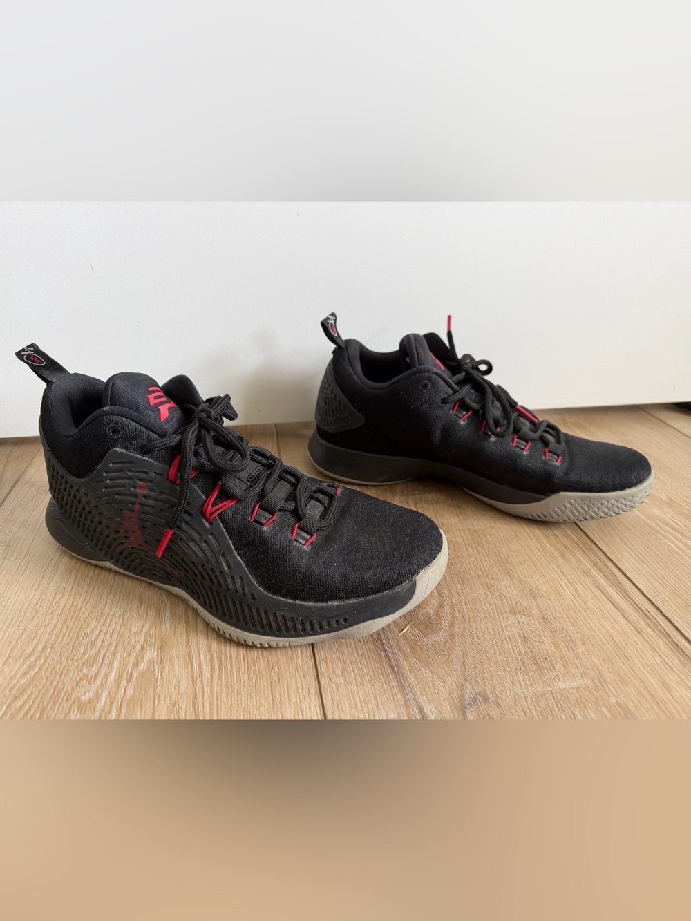 Jordan Men's Low-Top Black Athletic Shoes with Red Detailing